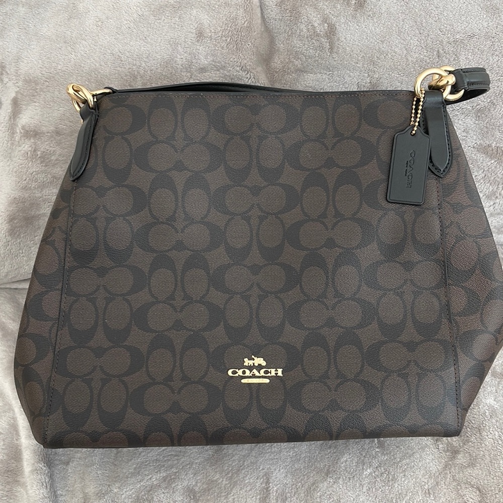 Brown and black couch bag